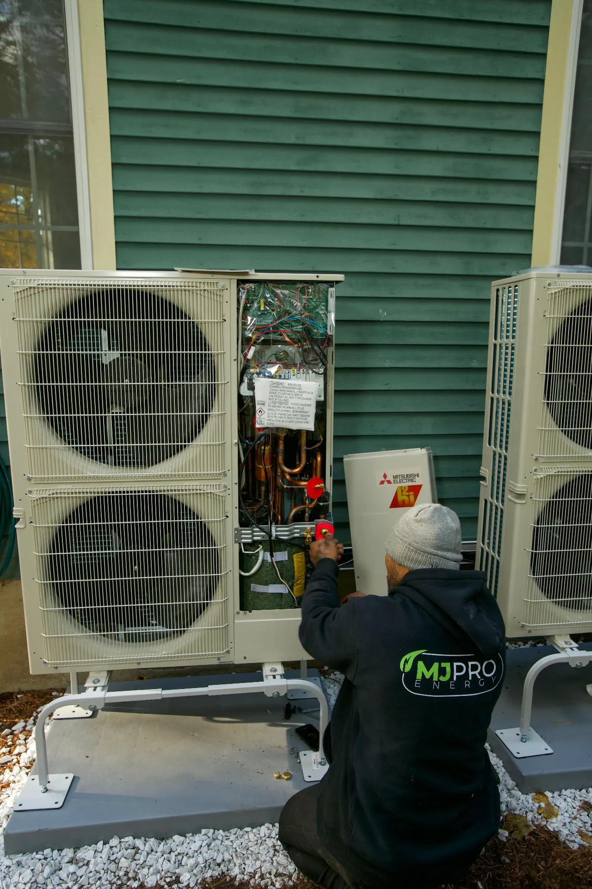 Technician repairing an air conditioner